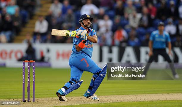 India batsman Suresh Raina hits six runs off England bowler Chris Woakes during the 2nd Royal London One Day International match between England and...