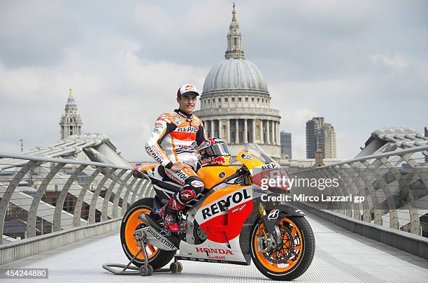 Marc Marquez of Spain and Repsol Honda Team poses with his bike at a photocall on the Millennium Bridge during previews for the MotoGp Of Great...