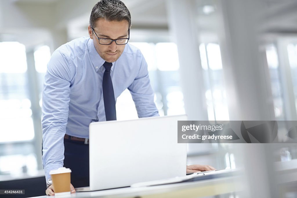 Checking his presentation notes