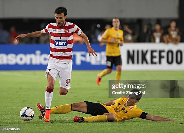 Labinot Haliti of Western Sydney Wanderers competes the ball with Zheng Zhi of Guangzhou Evergrande during the Asian Champions League Quarter Final...