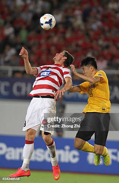 Tomi Juric of Western Sydney Wanderers in action with Liu Jian of Guangzhou Evergrande during the Asian Champions League Quarter Final match between...
