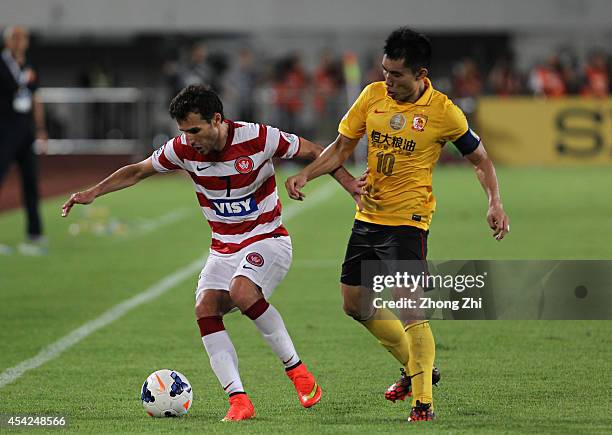 Labinot Haliti of Western Sydney Wanderers competes the ball with Zheng Zhi of Guangzhou Evergrande during the Asian Champions League Quarter Final...