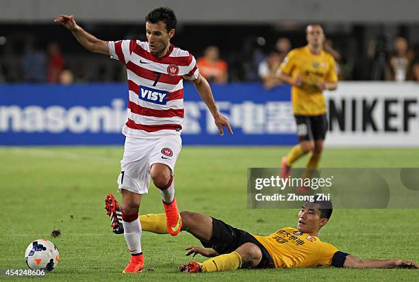 Labinot Haliti of Western Sydney Wanderers competes the ball with Zheng Zhi of Guangzhou Evergrande during the Asian Champions League Quarter Final...