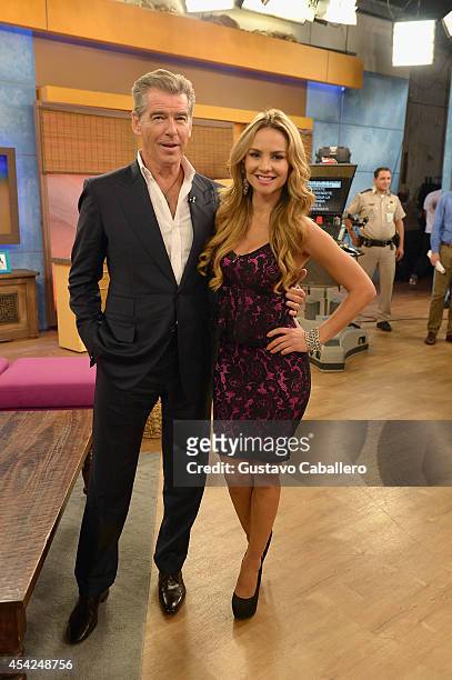 Pierce Brosnan and Ximena Cordoba on the set of Despierta America to promote The November Man at Univision Headquarters on August 27, 2014 in Miami,...