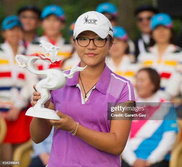 Winner of the 2013 Swinging Skirts World Ladies Masters, Lydia Ko of New Zealand, holds up her trophy, during the last day of the Swinging Skirts...