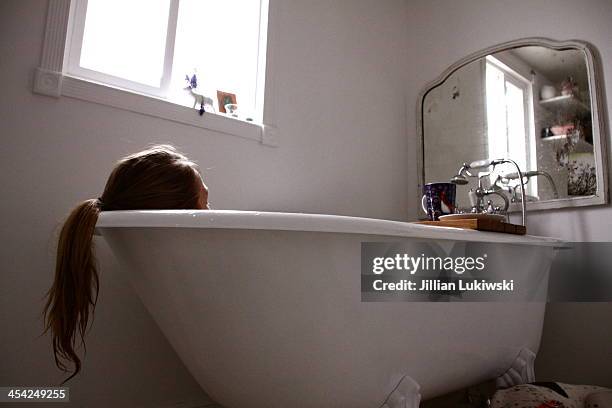 a soak in a claw foot tub - balneotherapy stock pictures, royalty-free photos & images