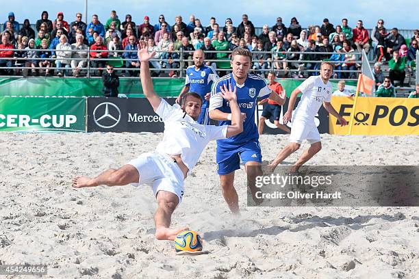 Player of Chemnitz challenges a player of Rostock during the final match between BST Chemnitz and Rostocker Robben on day one of the DFB Beachscoccer...