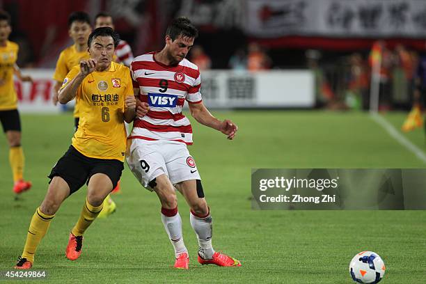 Tomi Juric of Western Sydney Wanderers in action with Feng Xiaoting of Guangzhou Evergrande during the Asian Champions League Quarter Final match...