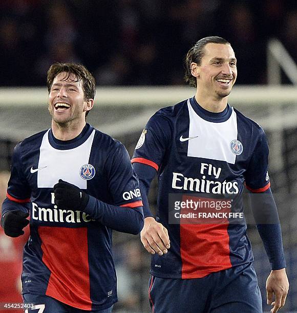 Paris Saint-Germain's Swedish forward Zlatan Ibrahimovic and Brazilian defender Maxwell smile after a goal during the French L1 football match Paris...