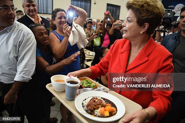 Presidential candidate for the Brazilian Workers' Party and current Brazilian President Dilma Rousseff , has lunch at a the "Presidente Getulio...