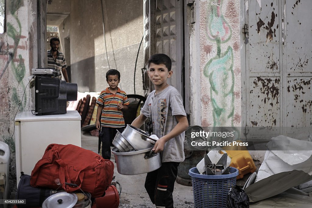 Local residents visit their destroyed homes to salvage their...