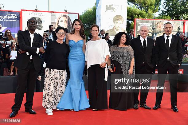 Official jury members Mahamat-Saleh Haroun, Ann Hui, Moran Atias, Pernilla August, Alin Tasciyan, David Chase and Roberto Minervini attend the...