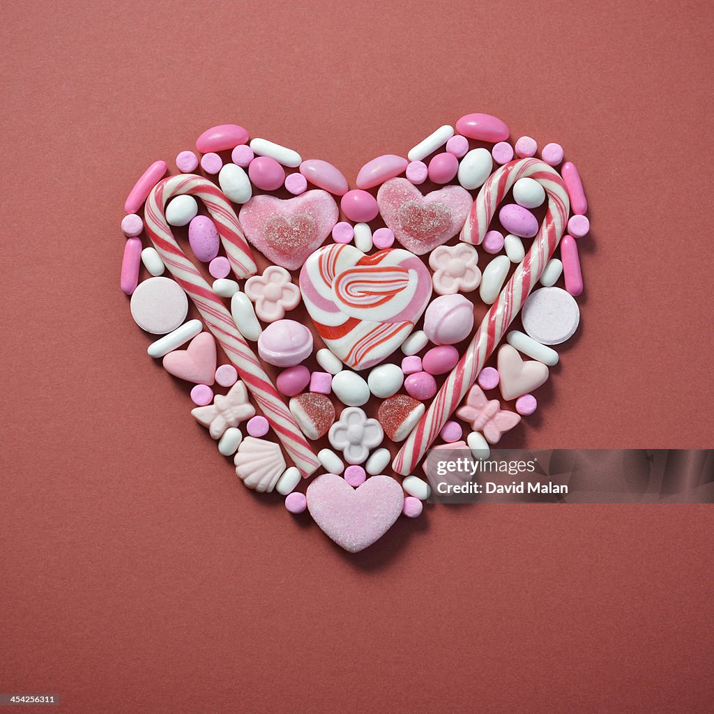 Sweets arranged in a heart shape.