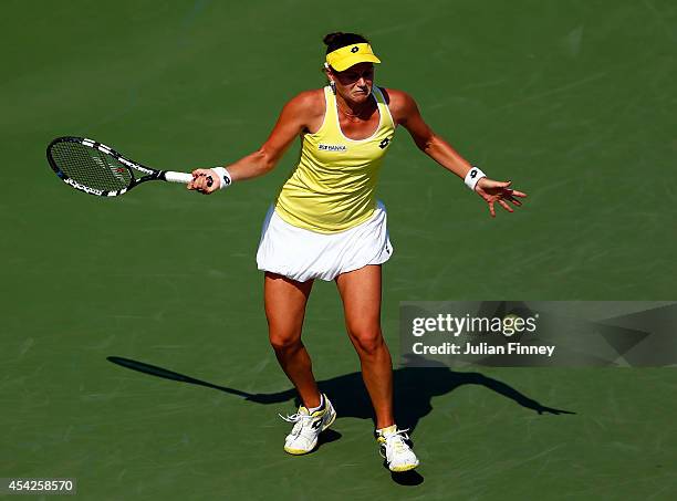 Jana Cepelova of Slovakia returns a shot against Simona Halep of Romania on Day Three of the 2014 US Open at the USTA Billie Jean King National...