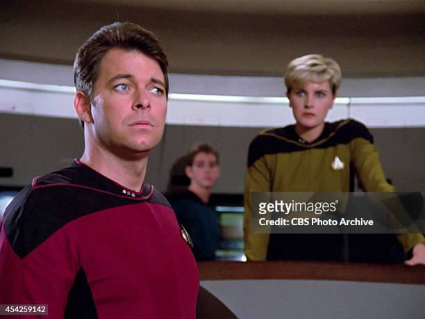 Jonathan Frakes as Commander William T. Riker in the Star Trek: The Next Generation episode, "The Big Goodbye." Denise Crosby as Lt. Tasha Yar is...