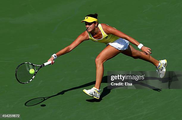 Jana Cepelova of Slovakia returns a shot to Simona Halep of Romania on Day Three of the 2014 US Open at the USTA Billie Jean King National Tennis...