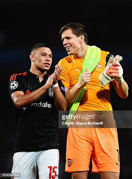 Alex Oxlade-Chamberlain of Arsenal and Wojciech Szczesny of Arsenal celebrate at the end of the UEFA Champions League Qualifier 2nd leg match between...