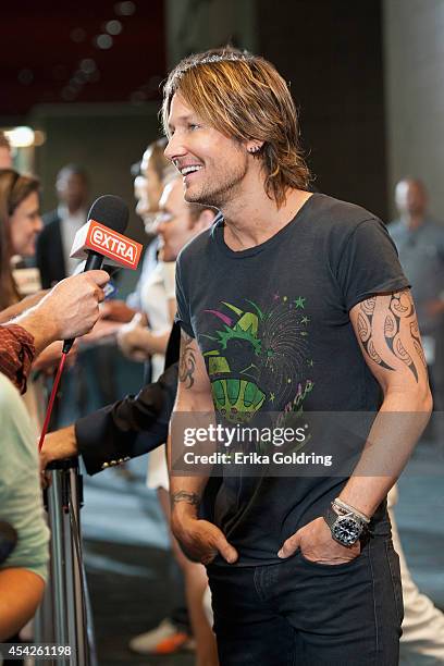Keith Urban is interviewed by press as he arrives at the Ernest N. Morial Convention Center on August 27, 2014 in New Orleans, Louisiana.