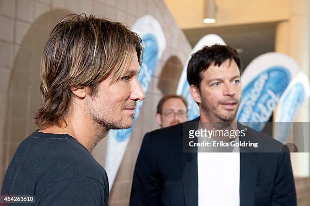 Keith Urban and Harry Connick, Jr. Are interviewed by press as they arrive at the Ernest N. Morial Convention Center on August 27, 2014 in New...