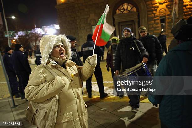 Activists protesting against the government chant slogans and wave Bulgarian national flags near the Presidential Palace on December 5, 2013 in...