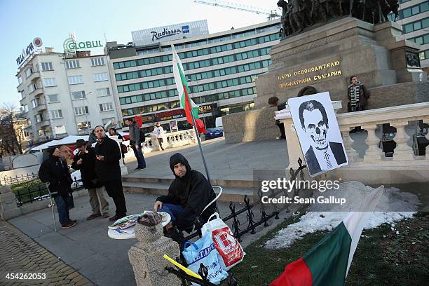 Activists protesting against government and police corruption maintain a vigil with a skull-like representation of Bulgarian Prime Minister Marin...