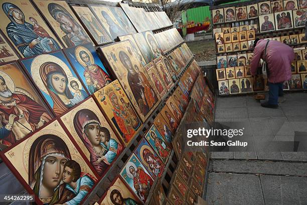 Vendor arranges religious icons at an outdoor stall in the city center on December 5, 2013 in Sofia, Bulgaria. Restrictions on the freedom of...