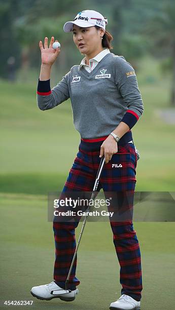 So Yeon Ryu of South Korea, collects her golf ball from the eighteenth hole, during the last day of the Swinging Skirts 2013 World Ladies Masters, at...