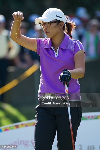 Lydia Ko of New Zealand, tests the wind with blades of grass, during the last day of the Swinging Skirts 2013 World Ladies Masters, at Miramar Golf &...