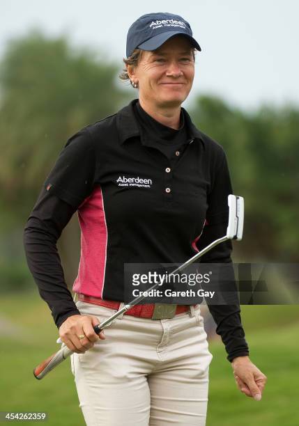 Catriona Matthew of Scotland, smiles and waves to spectators, on the eighteenth green, during the last day of the Swinging Skirts 2013 World Ladies...