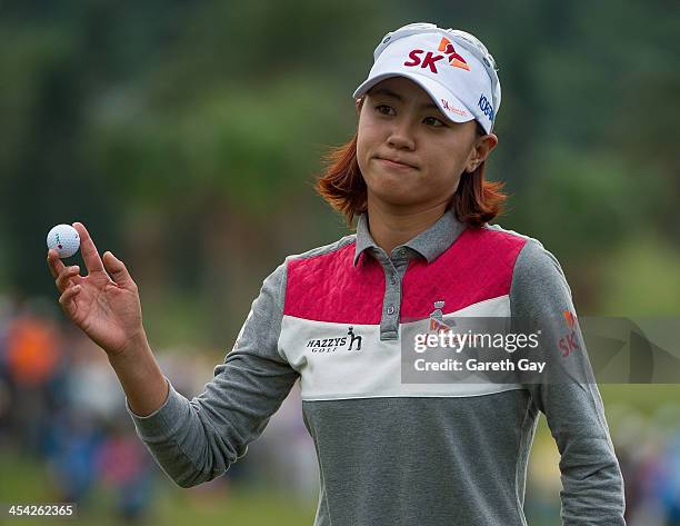 Na Yeon Choi of South Korea, collects her golf ball from the eighteenth hole, during the last day of the Swinging Skirts 2013 World Ladies Masters,...
