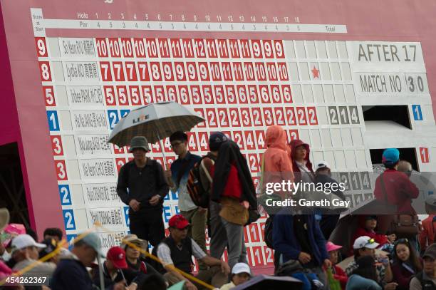 Spectators watch the Eighteenth green in front of the leaders board, during the last day of the Swinging Skirts 2013 World Ladies Masters, at Miramar...