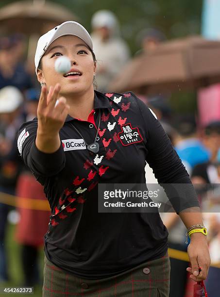 Ha Na Jang of South Korea, throws her golf ball to the spectators on the eighteenth green, during the last day of the Swinging Skirts 2013 World...