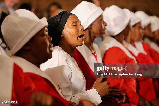 The congregation sing and dance during a service at Bryanston Methodist Church during a national day of prayer, on December 8, 2013 in Johannesburg,...