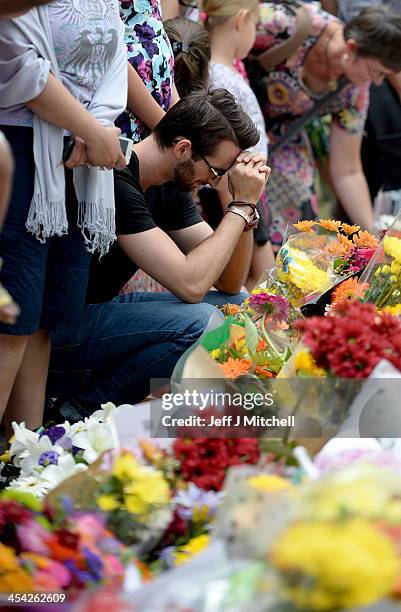 Members of the public gather at former presidents Nelson Mandelas Houghton home to pay their respects on December 8, 2013 in Johannesburg, South...