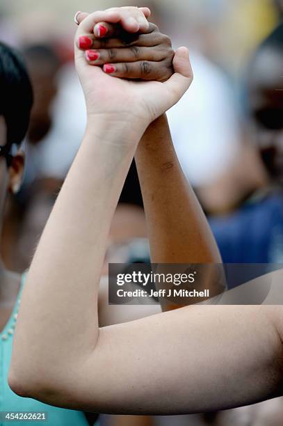 Members of the public gather at former presidents Nelson Mandelas Houghton home to pay their respects on December 8, 2013 in Johannesburg, South...