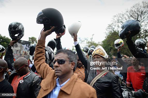 Motorcyclists arrive at former presidents Nelson Mandelas Houghton home to pay their respects on December 8, 2013 in Johannesburg, South Africa....