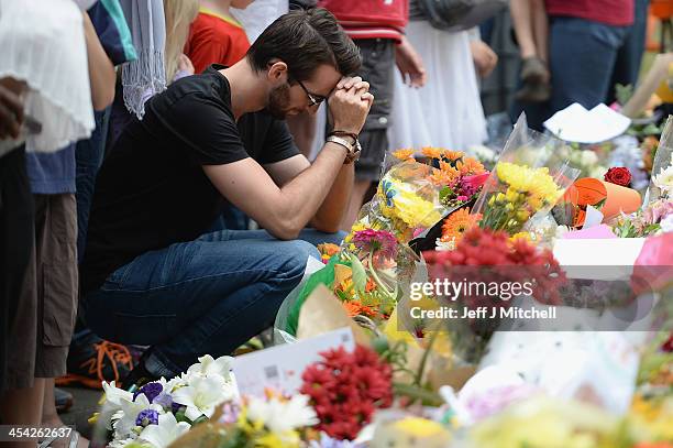 Members of the public gather at former presidents Nelson Mandelas Houghton home to pay their respects on December 8, 2013 in Johannesburg, South...