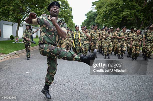 Members leave the former presidents Nelson Mandelas Houghton home after paying their respects on December 8, 2013 in Johannesburg, South Africa....