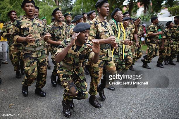 Members leave the former presidents Nelson Mandelas Houghton home after paying their respects on December 8, 2013 in Johannesburg, South Africa....
