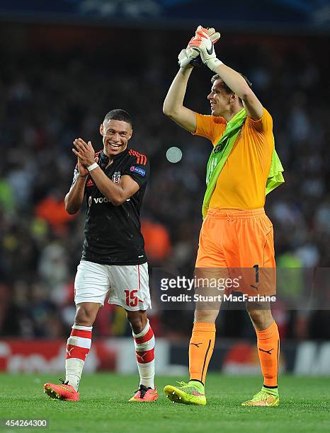 Alex Oxlade-Chambelain and Wojciech Szczesny celebrate Arsenal victory after the UEFA Play Off match between Arsenal and Besiktas at Emirates Stadium...