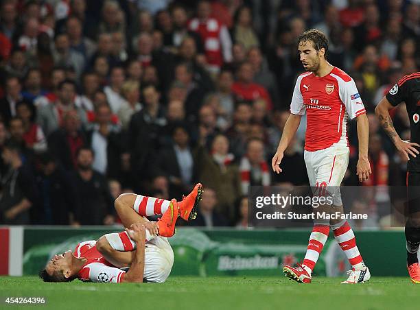 Alexis Sanchez and Mathieu Flamini of Arsenal during the UEFA Play Off match between Arsenal and Besiktas at Emirates Stadium on August 27, 2014 in...