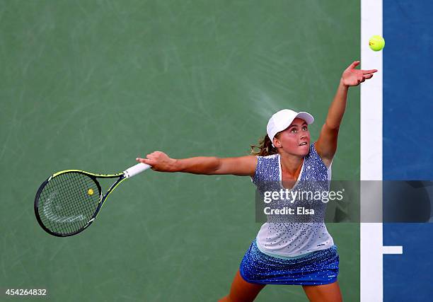 Aliaksandra Sasnovich of Belarus serves against Caroline Wozniacki of Denmark during their women's second round match on Day Three of the 2014 US...