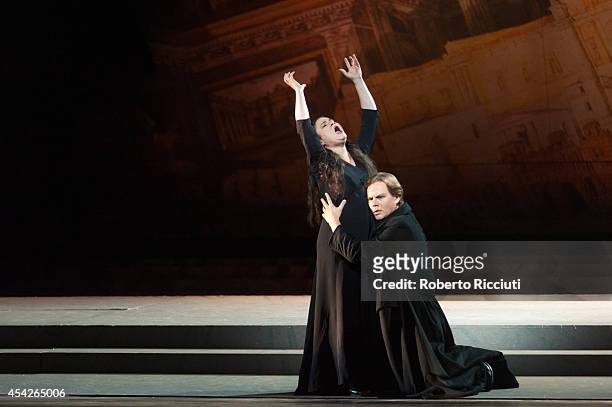Mlada Khudoley and Alexey Markov of Mariinsky Opera perform during a photocall for "Les Troyens" at the Edinburgh International Festival at Festival...