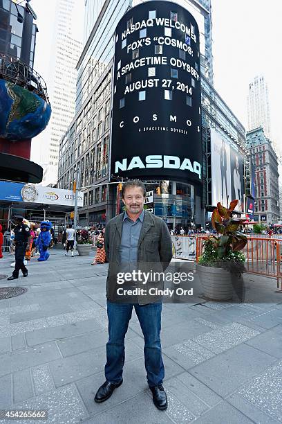 Cosmos: A SpaceTime Odyssey co-executive producer Jason Clark poses for a photo after ringing the closing bell at the NASDAQ MarketSite on August 27,...