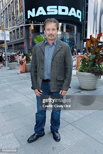 Cosmos: A SpaceTime Odyssey co-executive producer Jason Clark poses for a photo after ringing the closing bell at the NASDAQ MarketSite on August 27,...