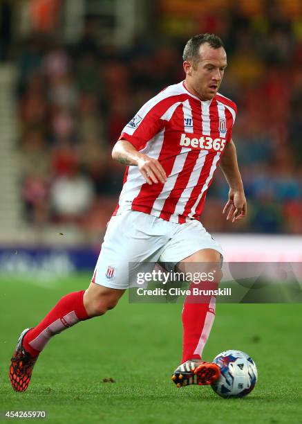 Charlie Adam of Stoke City in action during the Capital One Cup Second Round match between Stoke City and Portsmouth at Britannia Stadium on August...