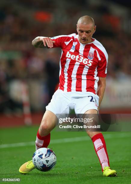 Andy Wilkinson of Stoke City in action during the Capital One Cup Second Round match between Stoke City and Portsmouth at Britannia Stadium on August...