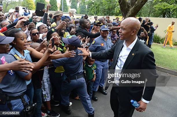 Bafana Bafana legend Doctor Khumalo greets fans...The thousands of tributes to Former President Nelson on December 7, 2013 in Johannesburg, South...