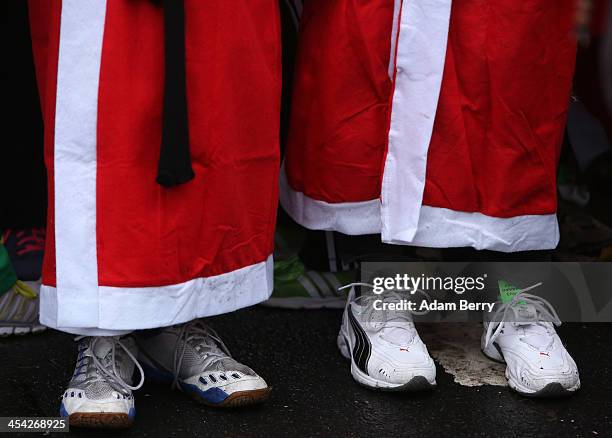 Participants line up to compete in the 5th annual Michendorf Santa Run on December 8, 2013 in Michendorf, Germany. Over 900 people took part in this...