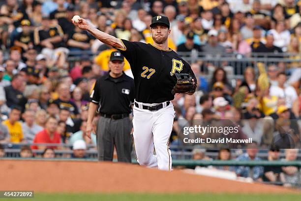 Jayson Nix of the Pittsburgh Pirates throws to first base against the San Diego Padres during the second inning of their game on August 9, 2014 at...